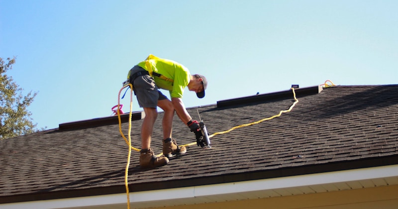 Roofer working on a residential roof