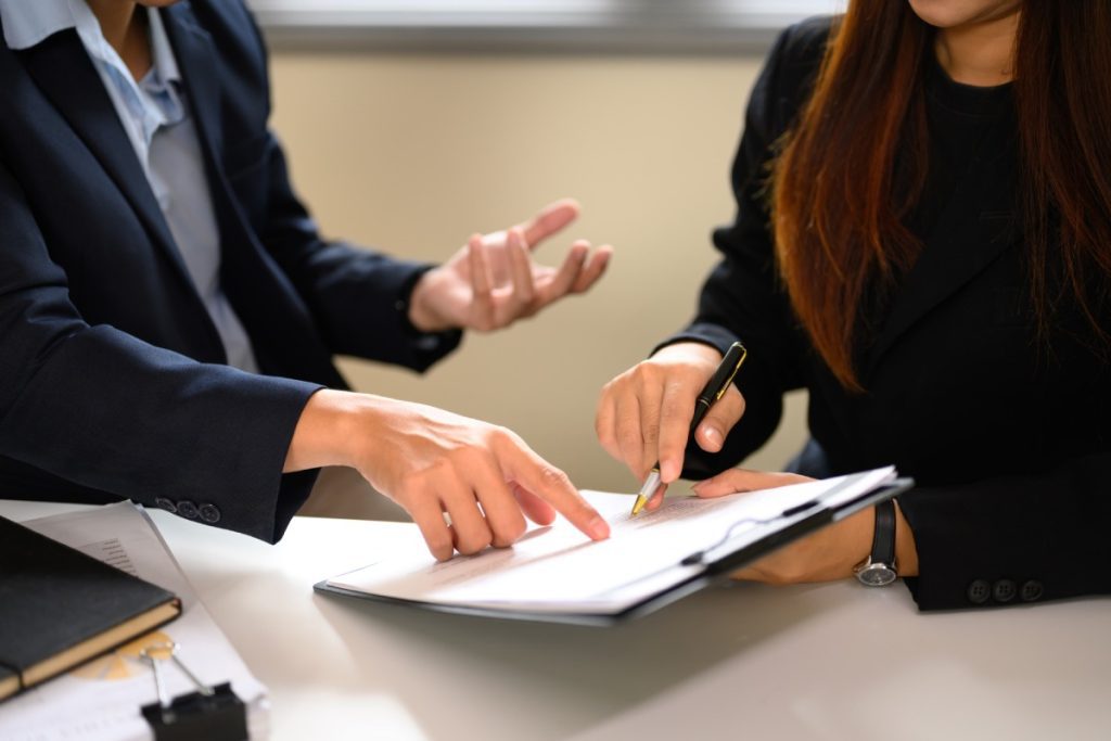 Homeowner reviewing documents with a contractor